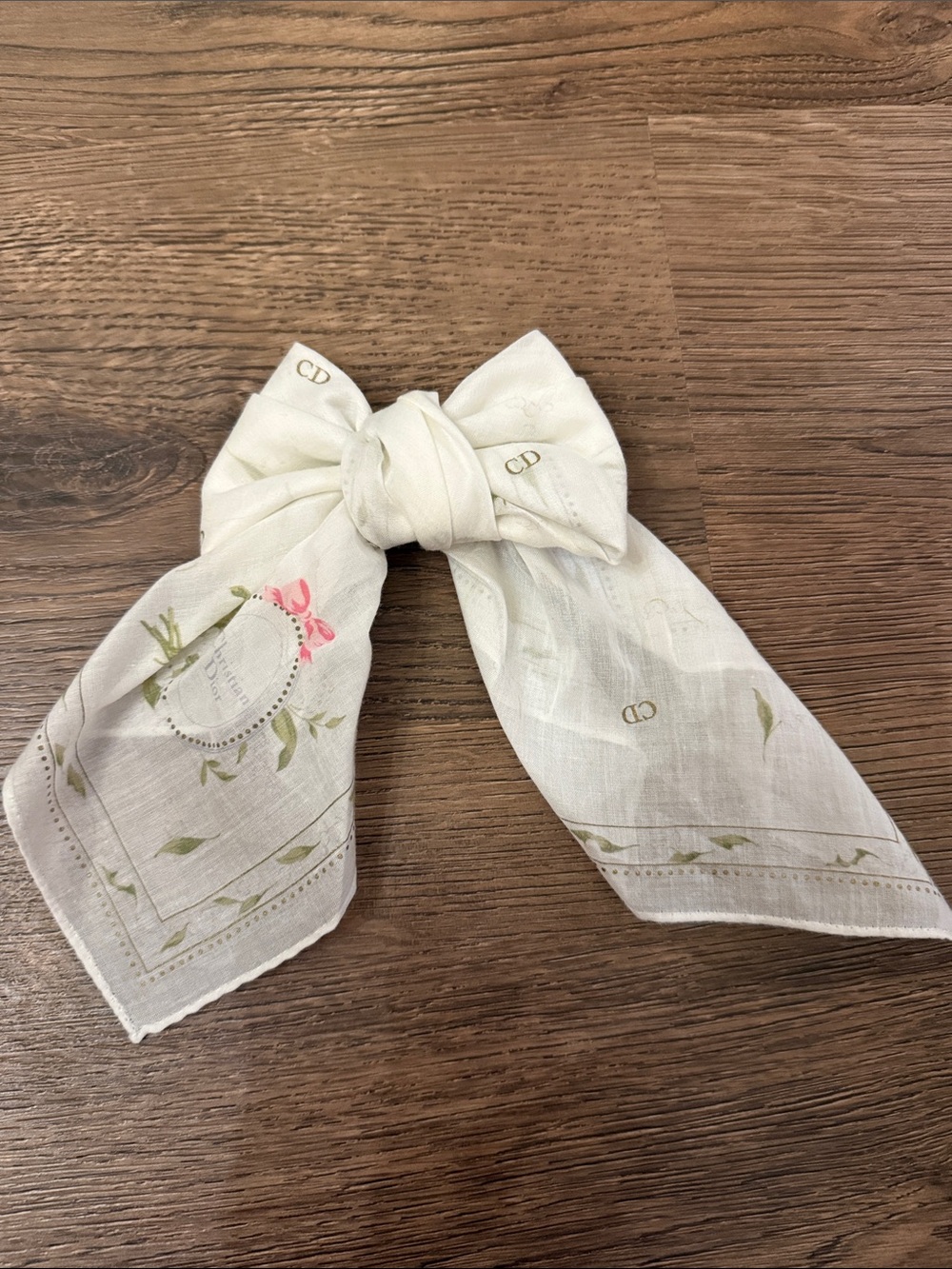 Vintage Christian Dior White Floral Logo Scarf tied into bow for image; cotton